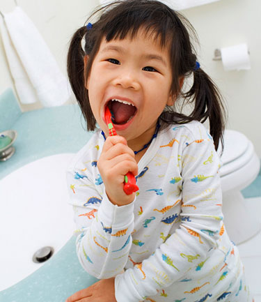 Brushing teeth and a regular visit to Staten Island general dentist Dr. Fred Hecht can help you have a clean oral health report card.